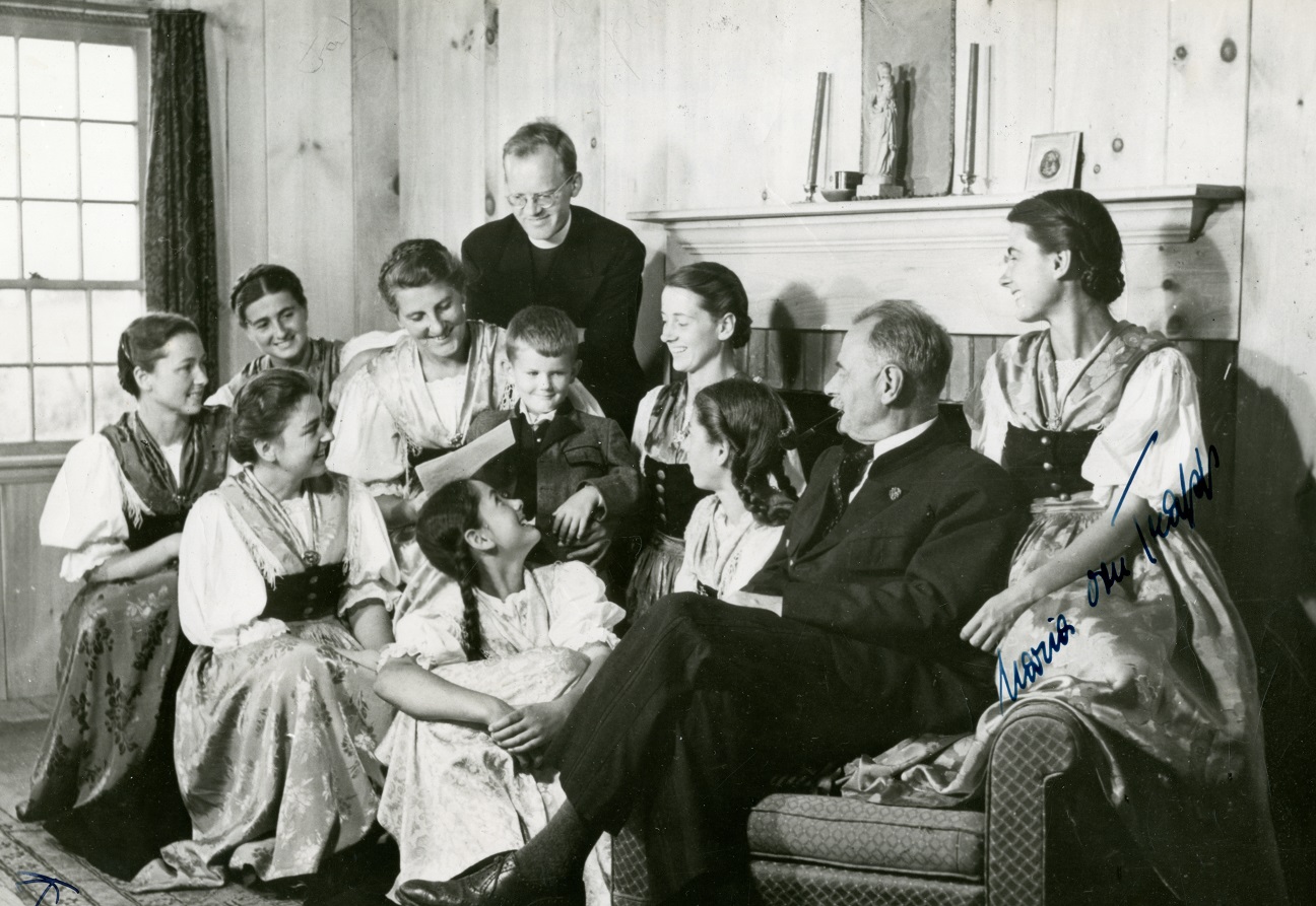Von Trapp family sitting on couch